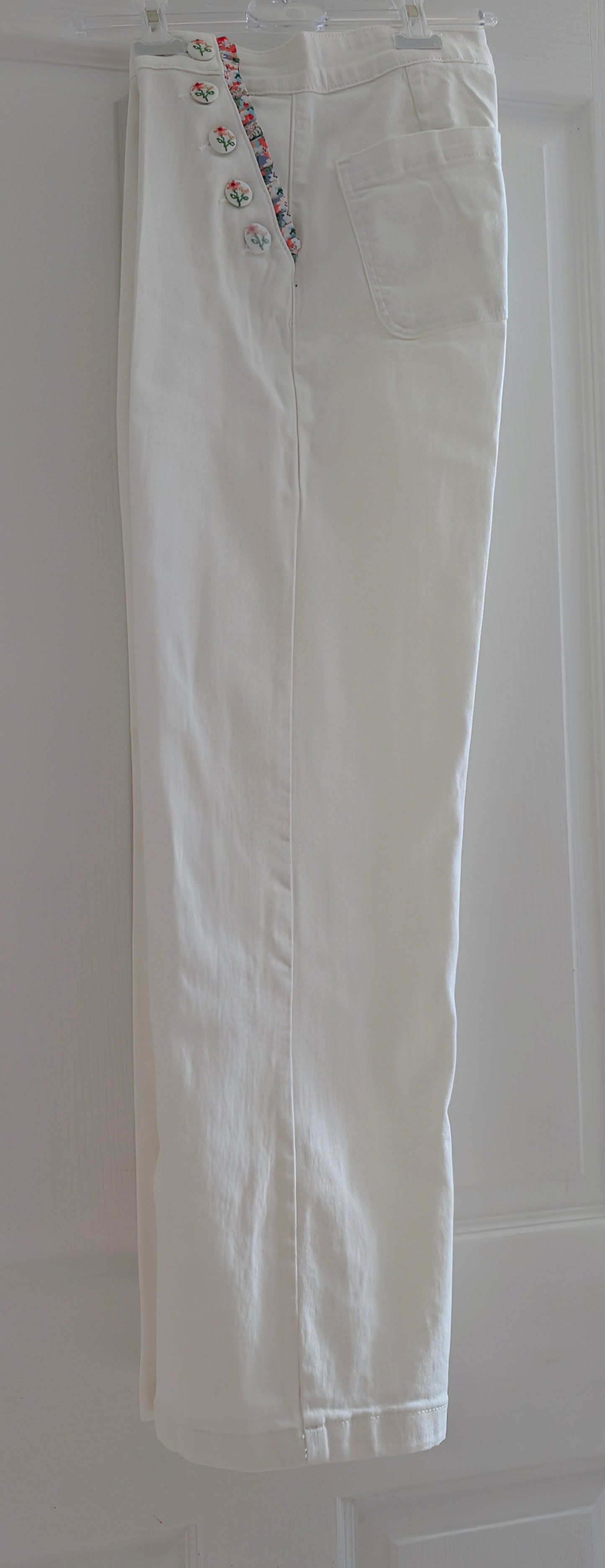 White Denim Trousers With Flowers On The Buttons